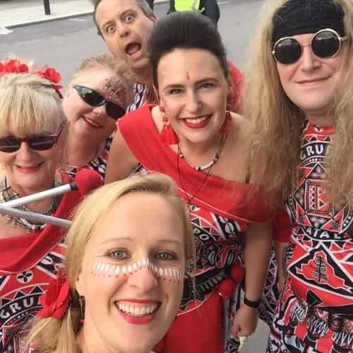 Smiling group of people in bright outfits