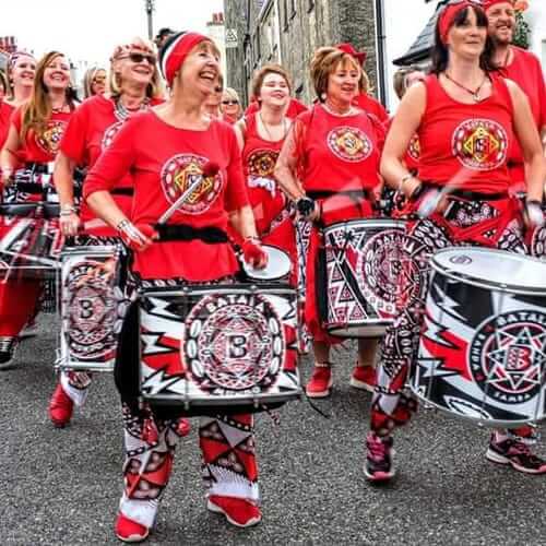Group parading and drumming on a street