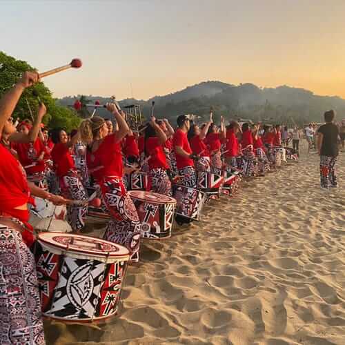 Drumming group on a tropical beach