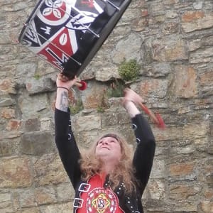 Man lifts drum in to air