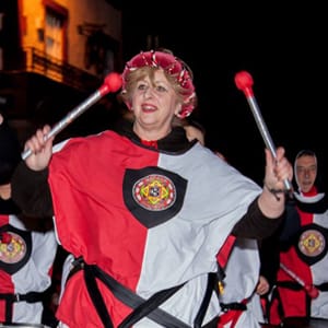Lady in red and white with beaters