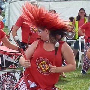 Girl swishes bright red hair